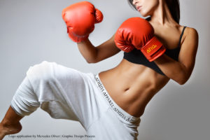 beautiful woman with the red boxing gloves, studio shot